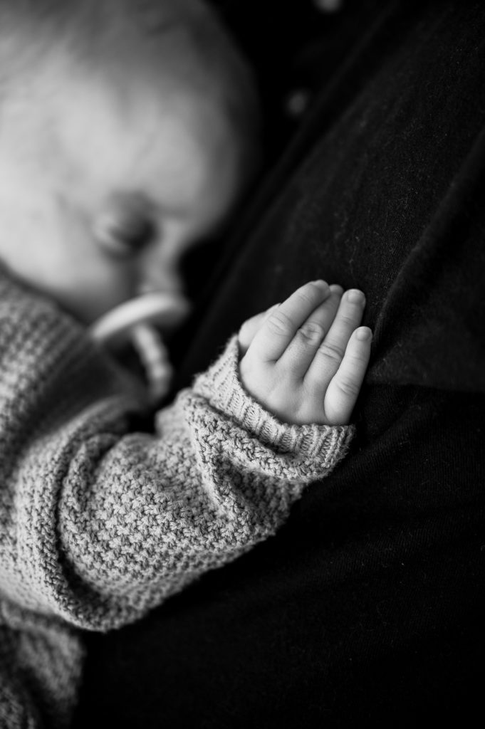 newborn fingers in black and white