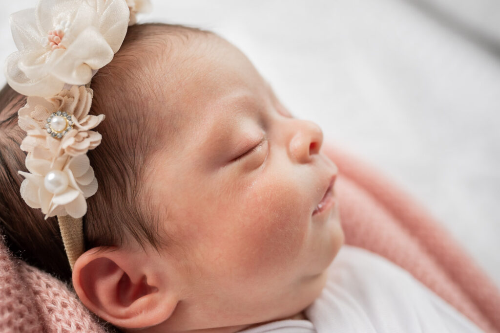 close up of baby profile with floral headband